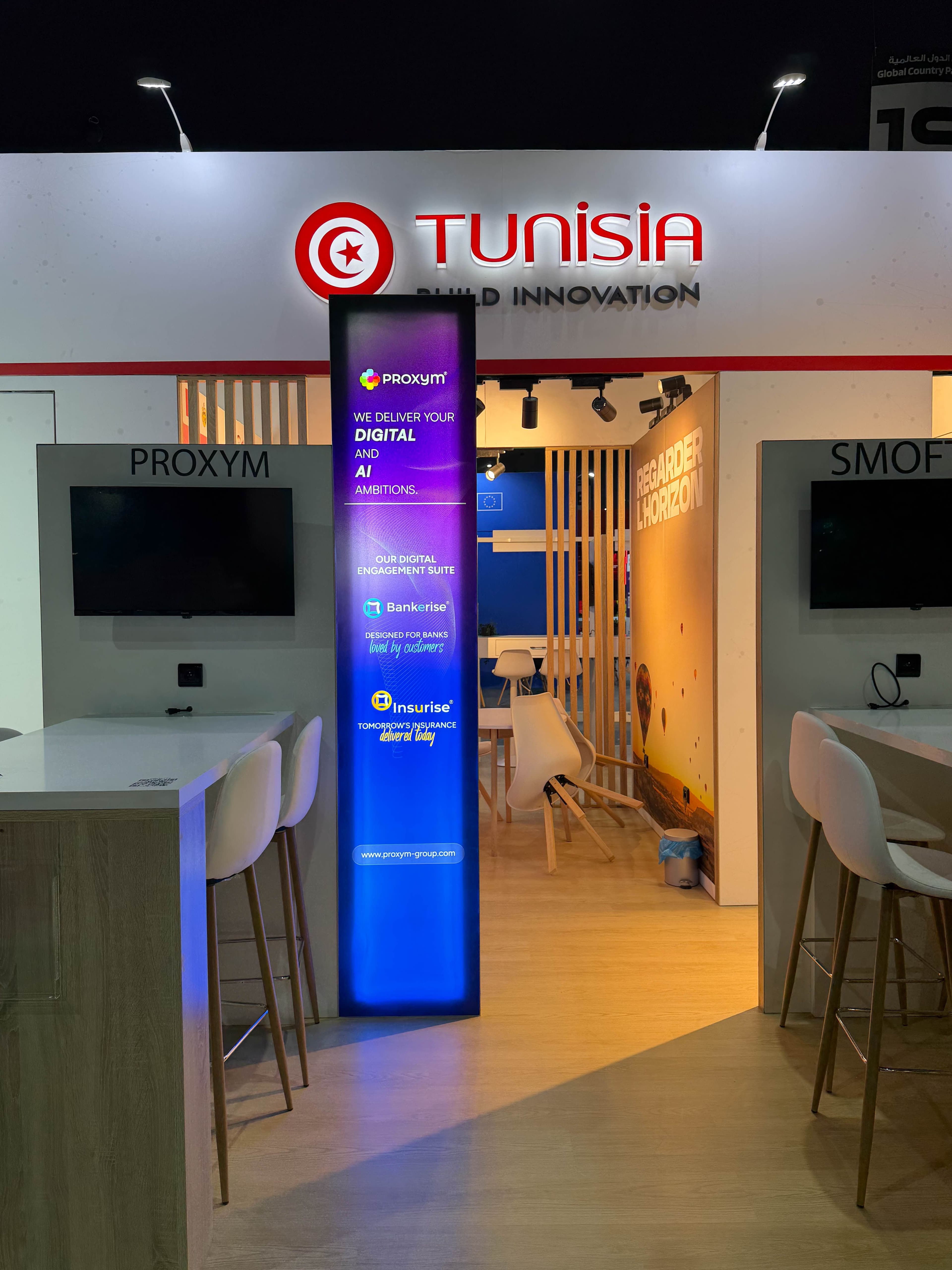 Illuminated totem and exhibitor pods inside the CEPEX pavilion at GITEX Africa 2026, Marrakech