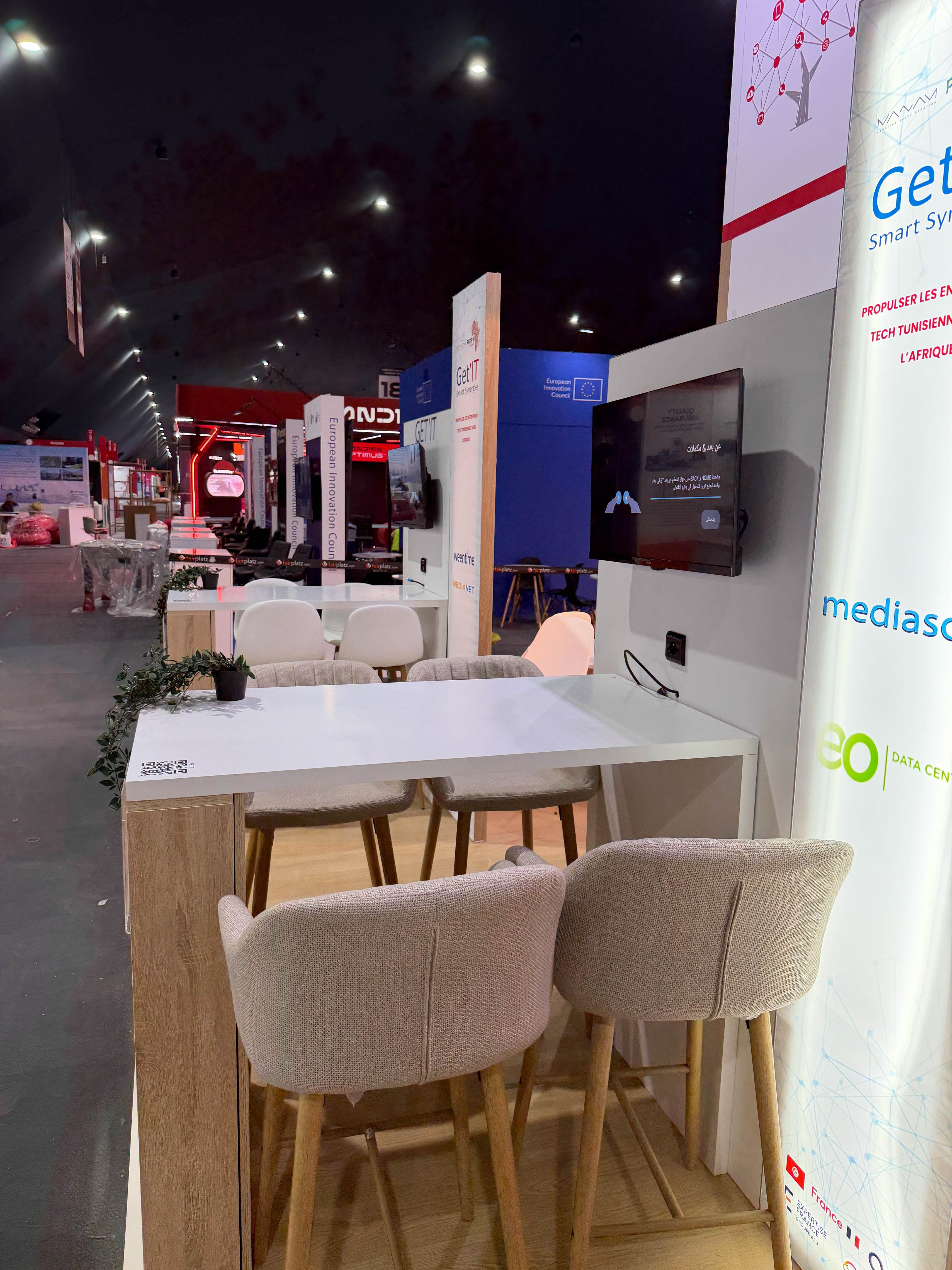 Meeting tables inside the CEPEX Tunisia National Pavilion at GITEX Africa 2026, Marrakech