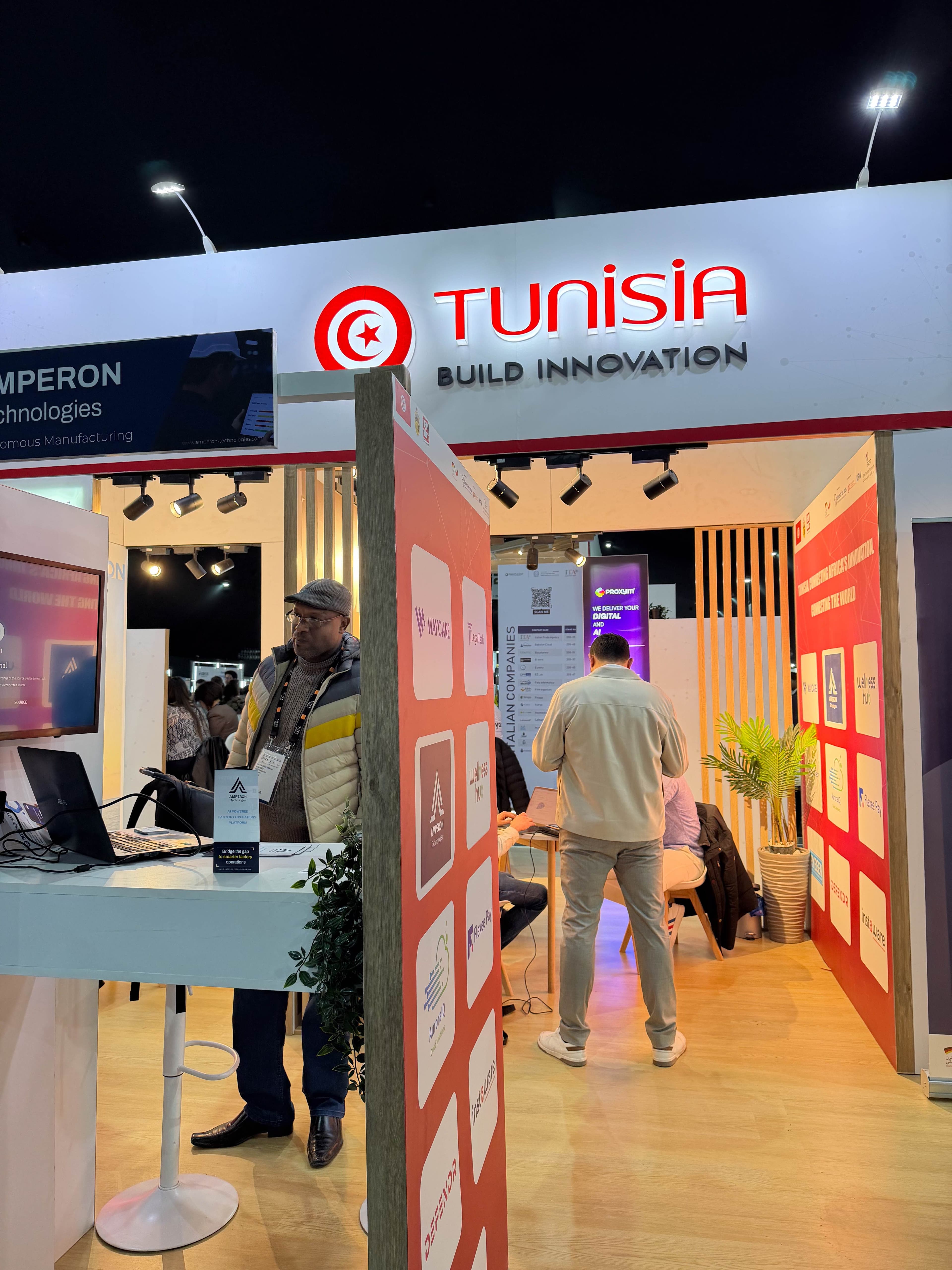 Exhibitor at a booth inside the CEPEX Tunisia National Pavilion, GITEX Africa 2026, Marrakech