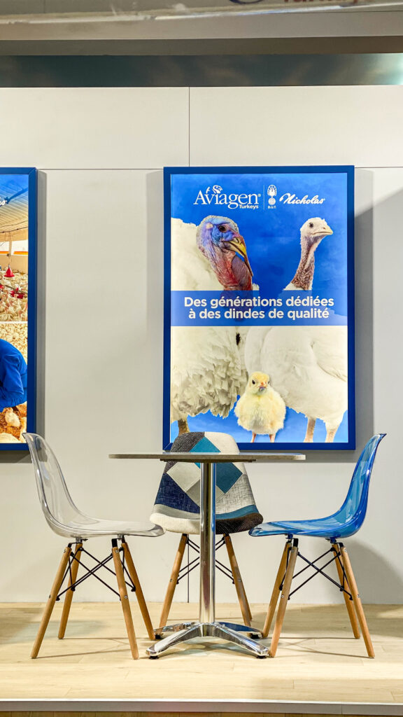 Illuminated lightboxes displaying Aviagen Turkeys branding and visuals at exhibition booth