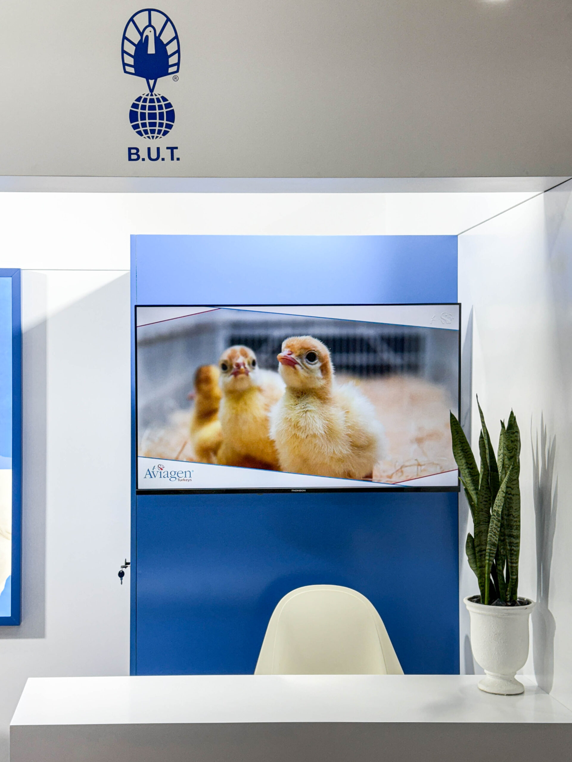 42-inch screen at Aviagen booth presenting turkey breeding technologies and company information